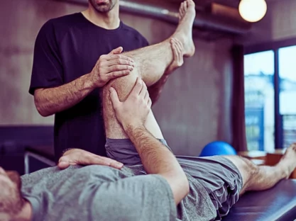 Young man visiting his physiotherapist for a rehabilitation session.