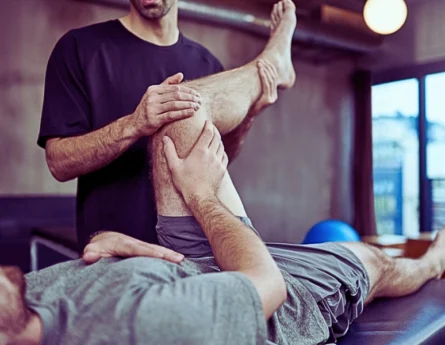 Young man visiting his physiotherapist for a rehabilitation session.