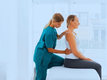 A professional doctor and a woman patient having her Chiropractic session.