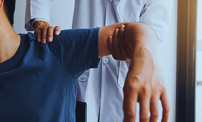 a physical therapy or medical rehabilitation session focused on shoulder mobility and function.